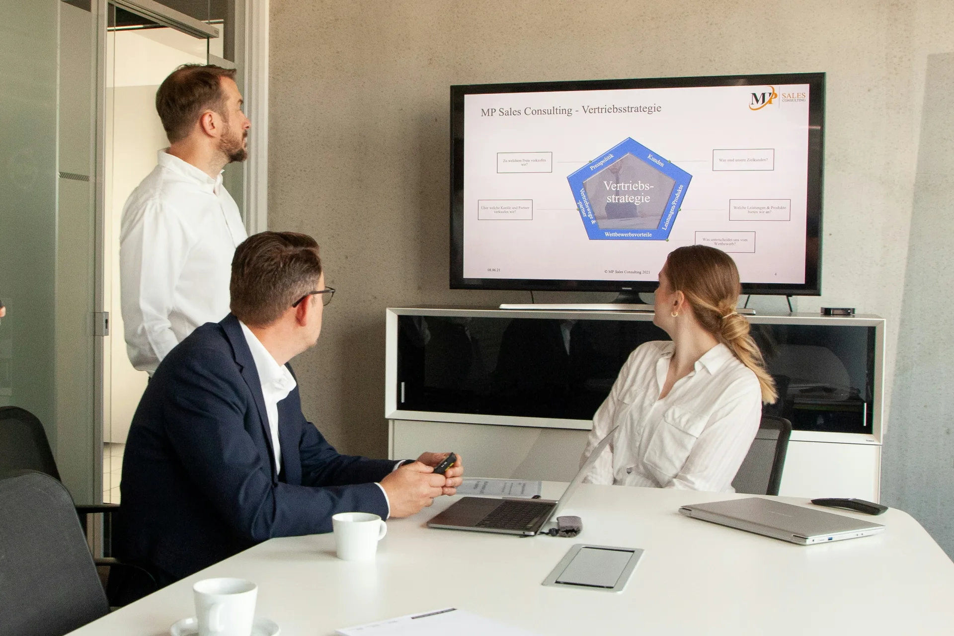 A team reviewing a business presentation together